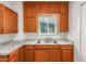 View of kitchen shows cabinets with sink near window with white countertop at 1505 W Fillmore St, Phoenix, AZ 85007