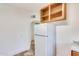 A kitchen with wood cabinets and a white refrigerator offers space to cook at 1505 W Fillmore St, Phoenix, AZ 85007