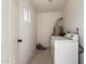 The laundry room features a washer, dryer, and water heater, with a window for natural light at 1505 W Fillmore St, Phoenix, AZ 85007