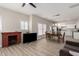 Inviting living space featuring neutral walls, wood-look floors, and a cozy brick fireplace at 1505 W Fillmore St, Phoenix, AZ 85007