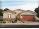 Charming single-story home featuring desert landscaping, a two-car garage, and a welcoming front entrance at 153 N 175Th Ave, Goodyear, AZ 85338