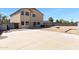 Large concrete backyard with gravel perimeter and block fencing at 1612 E Desert Rose Trl, San Tan Valley, AZ 85143