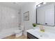 Bright bathroom with updated shower, modern fixtures and beautiful flooring at 1612 E Desert Rose Trl, San Tan Valley, AZ 85143