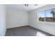 Clean bedroom with gray carpet, a window providing natural light and outdoor views at 1612 E Desert Rose Trl, San Tan Valley, AZ 85143