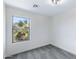 Bright bedroom with gray carpet and a window offering serene outdoor views at 1612 E Desert Rose Trl, San Tan Valley, AZ 85143