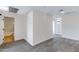 Neutral bedroom featuring cozy gray carpet, leading to bright bathroom at 1612 E Desert Rose Trl, San Tan Valley, AZ 85143