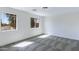 Bright bedroom with gray carpet and dual windows bringing in natural light at 1612 E Desert Rose Trl, San Tan Valley, AZ 85143