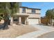 Attractive two-story home with stone accents, a two-car garage, and desert landscaping at 1612 E Desert Rose Trl, San Tan Valley, AZ 85143