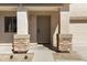 Inviting front entrance features stone accents and a neutral-colored door with matching trim for a modern aesthetic at 1612 E Desert Rose Trl, San Tan Valley, AZ 85143