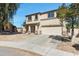 Two-story home with neutral stucco, concrete driveway, and two-car garage at 1612 E Desert Rose Trl, San Tan Valley, AZ 85143