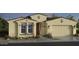 Beautiful single story home with a two car garage and neutral colored stucco exterior at 16928 W Jenan Rd, Surprise, AZ 85388