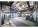 Modern community gym with state-of-the-art fitness equipment and a view of the pool at 16928 W Jenan Rd, Surprise, AZ 85388
