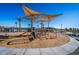 Community playground featuring modern play equipment and a shaded area, perfect for  at 16928 W Jenan Rd, Surprise, AZ 85388