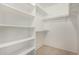 Walk-in closet featuring ample storage with built-in shelves and hanging rods for optimal organization at 1822 S 39Th St # 7, Mesa, AZ 85206