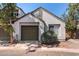 Exterior view of home with two-car garage, stucco siding, and desert landscaping at 1822 S 39Th St # 7, Mesa, AZ 85206