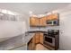 Kitchen featuring stainless steel appliances and wooden cabinetry at 1822 S 39Th St # 7, Mesa, AZ 85206