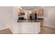 Kitchen area featuring stainless steel appliances, gray counters and wooden cabinets at 1822 S 39Th St # 7, Mesa, AZ 85206