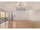 Bright living room with vaulted ceiling, fan, and slider to the backyard at 1822 S 39Th St # 7, Mesa, AZ 85206