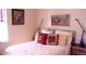 Bedroom featuring a comfortable bed and decorative pillows at 1837 W Roma Ave, Phoenix, AZ 85015