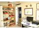 Functional office space with shelving and a compact desk setup at 1837 W Roma Ave, Phoenix, AZ 85015