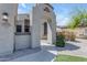Inviting entryway showcasing a decorative archway leading to the home's elegant front door at 18437 E Celtic Manor Dr, Queen Creek, AZ 85142