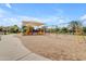 Spacious playground with slides, swings, and play structures, offering a variety of activities at 18437 E Celtic Manor Dr, Queen Creek, AZ 85142