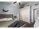 Bright bedroom with a ceiling fan and closet storage at 18643 N 73Rd Ave, Glendale, AZ 85308