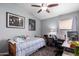 Bedroom with a wooden bed frame and desk at 18643 N 73Rd Ave, Glendale, AZ 85308