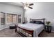 Cozy bedroom featuring a large window, a ceiling fan and stylish furnishings at 18643 N 73Rd Ave, Glendale, AZ 85308