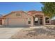 Inviting single-story home with a two-car garage and desert landscaping at 18643 N 73Rd Ave, Glendale, AZ 85308