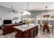 Spacious kitchen island featuring granite countertops, pendant lighting, and convenient seating and an open layout at 18643 N 73Rd Ave, Glendale, AZ 85308