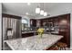 Modern kitchen featuring granite countertops, stainless steel appliances, and a stylish tile backsplash at 18643 N 73Rd Ave, Glendale, AZ 85308
