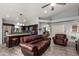 Comfortable living room and kitchen boasts an open layout, creating a seamless flow for modern living at 18643 N 73Rd Ave, Glendale, AZ 85308