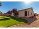 Side of the house showing the green grass and rock landscaping of the yard at 1865 S Morrison Ln, Gilbert, AZ 85295