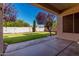 View of the grassy backyard and patio of this single-Gathering home at 1865 S Morrison Ln, Gilbert, AZ 85295