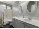 Bathroom featuring a double vanity and decorative wallpaper at 1865 S Morrison Ln, Gilbert, AZ 85295