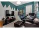Gameroom featuring colorful accent walls and large screen TV at 1865 S Morrison Ln, Gilbert, AZ 85295