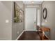 Elegant entryway with dark wood flooring and a white front door at 1865 S Morrison Ln, Gilbert, AZ 85295