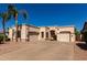 Single-story home featuring a three-car garage and desert landscaping at 1865 S Morrison Ln, Gilbert, AZ 85295
