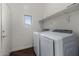 Well-lit laundry room with modern washer and dryer at 1865 S Morrison Ln, Gilbert, AZ 85295