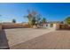 Backyard with gravel, fence, and a tree at 1919 W Fairmount Ave, Phoenix, AZ 85015