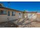 Backyard featuring a patio with neutral-toned exterior and white door at 1919 W Fairmount Ave, Phoenix, AZ 85015