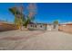 Backyard with gravel, brick building, and tree at 1919 W Fairmount Ave, Phoenix, AZ 85015