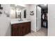 Beautiful bathroom boasting a modern vanity, tiled shower, and a walk-in closet at 1919 W Fairmount Ave, Phoenix, AZ 85015