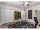 Bedroom with gray carpet, soundproofing panels, and a ceiling fan with light at 1919 W Fairmount Ave, Phoenix, AZ 85015