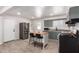 Spacious kitchen with modern appliances, central island with seating, and wood-look tile flooring at 1919 W Fairmount Ave, Phoenix, AZ 85015