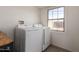Laundry room with window, a washer, and dryer at 1919 W Fairmount Ave, Phoenix, AZ 85015