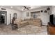 Bright living room with a cozy sectional sofa, stylish decor, and wood-look flooring at 1919 W Fairmount Ave, Phoenix, AZ 85015