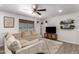 Bright and inviting living room featuring a comfortable sectional, ceiling fan, and modern decor at 1919 W Fairmount Ave, Phoenix, AZ 85015