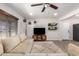 Bright and inviting living room featuring a comfortable sectional, ceiling fan, and modern decor at 1919 W Fairmount Ave, Phoenix, AZ 85015